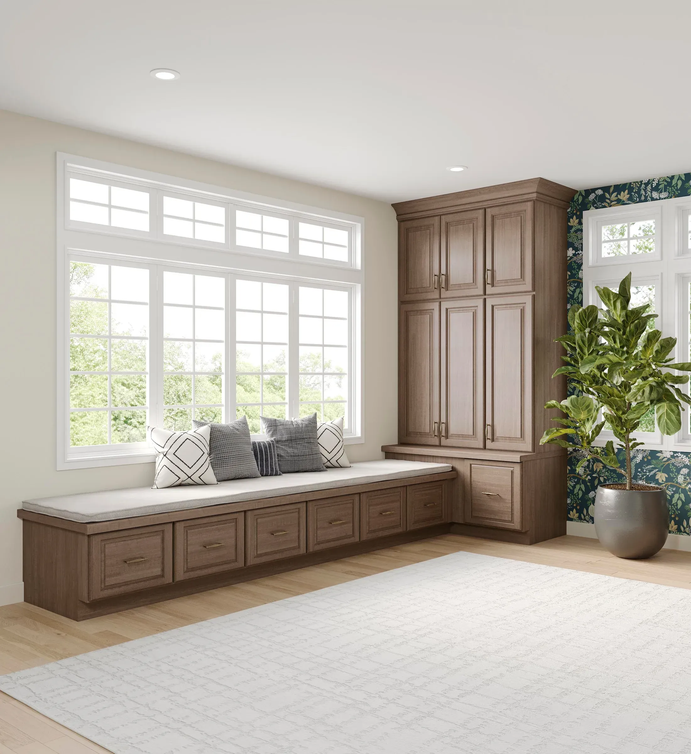 Window seat with drawer storage beneath, flanked by full-height almond maple cabinets.